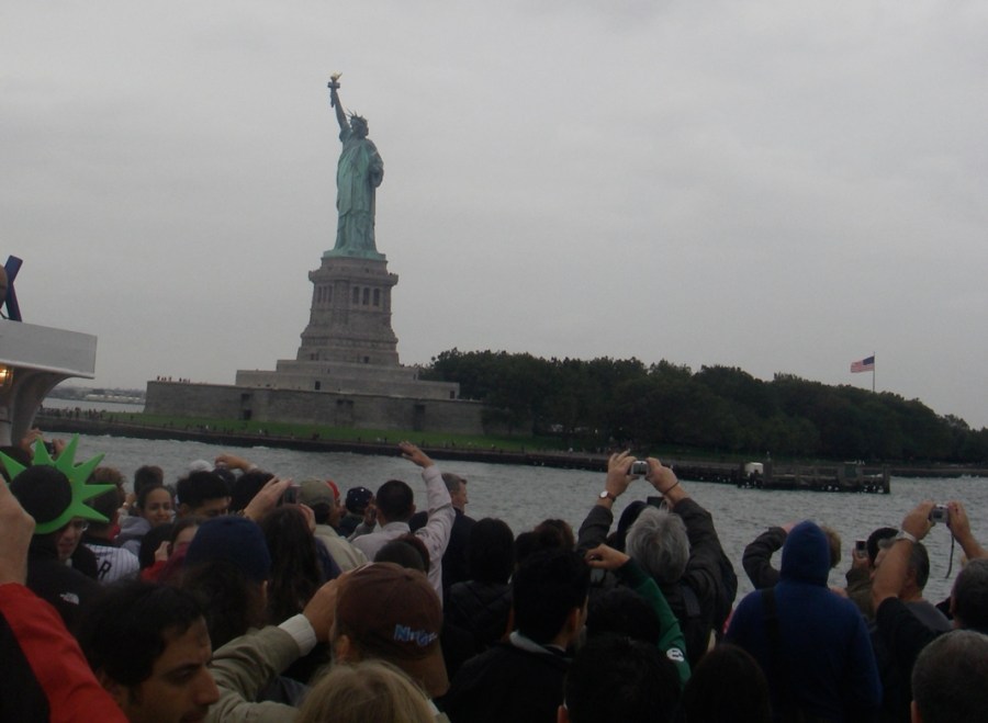 The Statue of Liberty and lots of hands