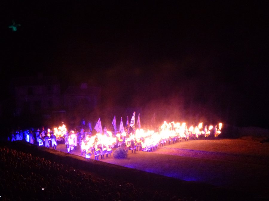 Drummers arrive with their drumsticks on fire at Cinescenie at Puy du Fou